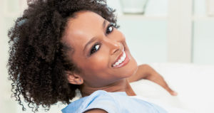 Black woman 30s big smile looking at camera